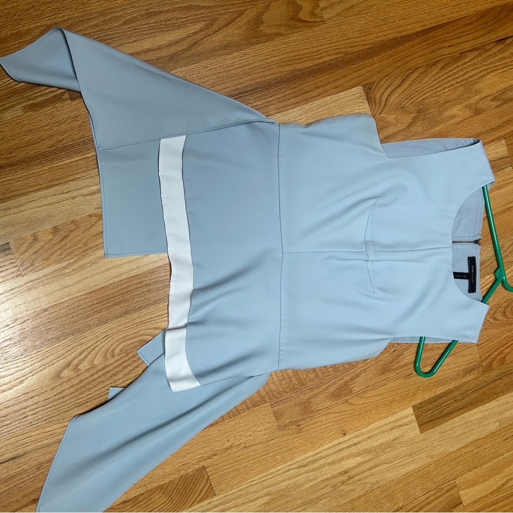 BCBGMaxarzia Fashion top with flowing side panels.